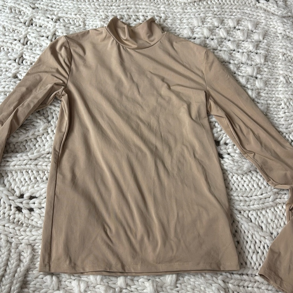 Vince. Brand Revolve Turtleneck in Tan
